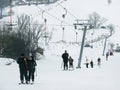 Skiers are on a ski lift (rope tow). Royalty Free Stock Photo